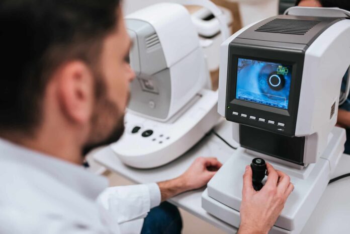 Handsome,Male,Doctor,Ophthalmologist,Is,Checking,The,Eye,Vision,Of